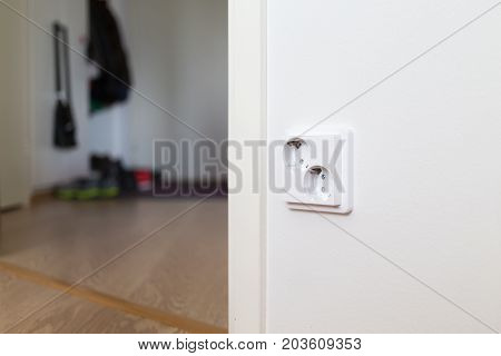 White wall socket on wall. Object photo.