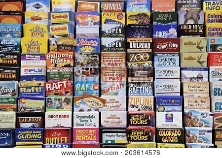 AUGUST 2017 -  WESTMINSTER, CO : Colorful Colorado Tourist Brochures arranged in a rack in a hotel lobby in Westminster, Co in Aug 2017