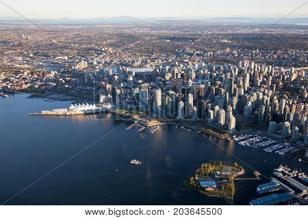 Beautiful Aerial View of Vancouver Downtown British Columbia Canada during a bright spring sunset.