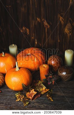 Autumn Pumpkin Thanksgiving Background - orange pumpkins over wooden table