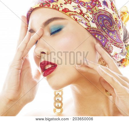 young pretty modern girl with bright shawl on head emotional posing isolated on white background, asian people ethnicity closeup