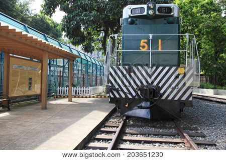 HONG KONG -JULY 16, 2014: Retired historical green trains at Tai Po on July 16, 2014 in Hong Kong. This historical diesel locomotives are parked at the only railway museum in Hong Kong.