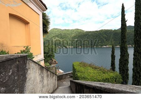Lake Lugano viewed from Santa Maria del Sasso, cathedral of Morcote in Switzerland
