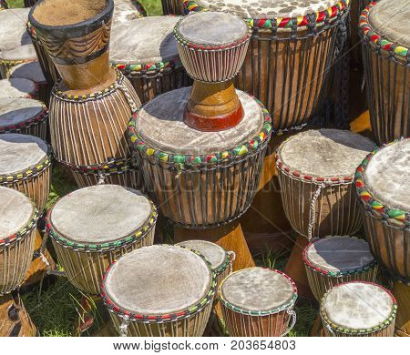 lots of african djembe drums in sunny ambiance