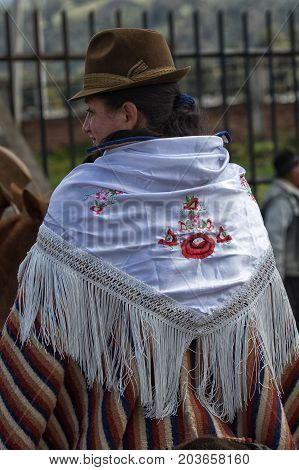 June 10 2017 Toacazo Ecuador: embroided shal worn over poncho by a local indigenous woman at rodeo