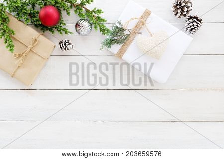 Christmas themes Background. Christmas present gifts box and decoration rustic elements on white wood board. Creative flat lay top view design