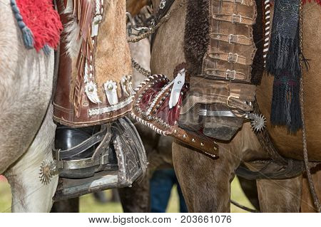 June 10 2017 Toacazo Ecuador: foot of local cowboys equipped for rodeo with cjaps and spurs
