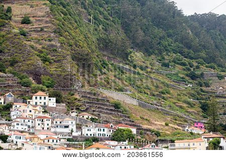 Fields and houses along west coast near Porto Moniz on Madeira Island. Portugal