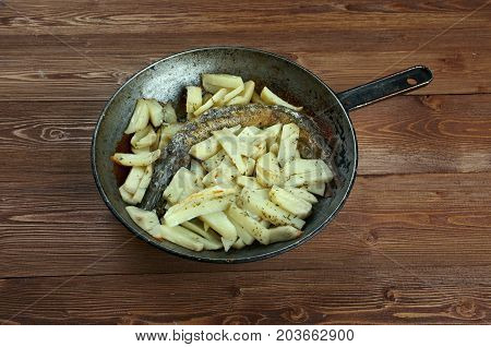 Baked pike with potatoes. home cooking. ountry cuisine