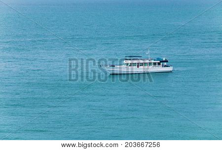 Boat on blue ocean. Water transportation and travel.