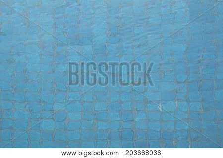 Water in the pool. Blue tile in swimming pool. Detail of pool.