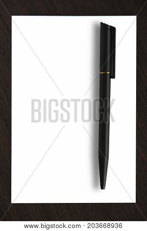 Blank paper with black pen. White paper and black pen on wooden table.
