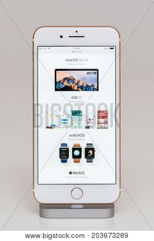 PARIS FRANCE - SEP 26 2016: New Apple iPhone 7 Plus in docking station after unboxing and testing by installing and running the Apple Website with Macos Sierra now awailable and apple watch available