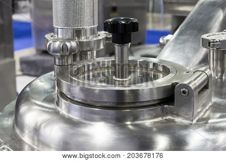 Pharmaceutical equipment, a fragment of the compression cap. Abstract industrial background.