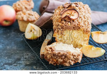 Apple Cinnamon Streusel Cake On A Wire Rack On A Blue Stone Background. View From Above.