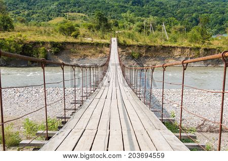 Suspension Cable Bridge, Crossing The River. Adygea Republic, Krasnodar Region, Russia