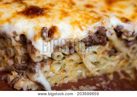 Pastitsio Traditional Greek Baked Pasta Casserole With Ground Beef, Tomatoes, Feta Cheese And Becham