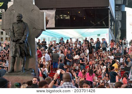 NEW YORK CITY - AUG. 26 : Unidentified people on the Times Square in Manhattan on August 26 2017 in New York City NY. Times Square is a major tourist destination and entertainment center.