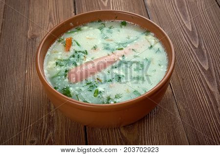 Kartoffel-Cremesuppe. potato soup with Vienna sausage , close up meal