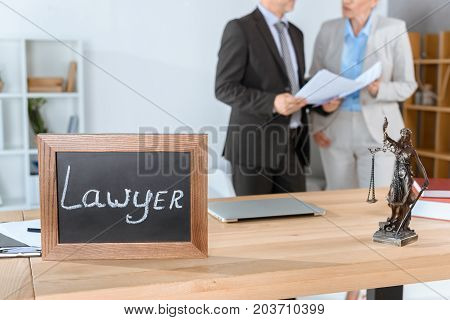 Lawyer Workplace With Themis Sculpture