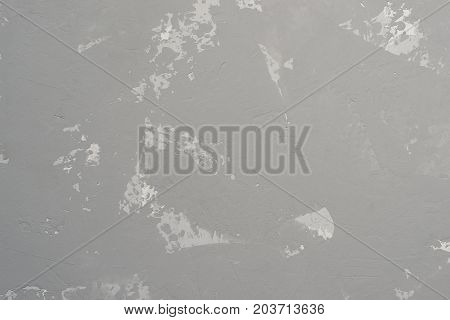 Gray heterogeneous concrete background with traces of spatula.