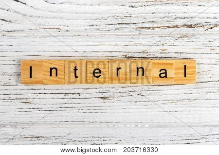 INTERNAL word made with wooden blocks concept