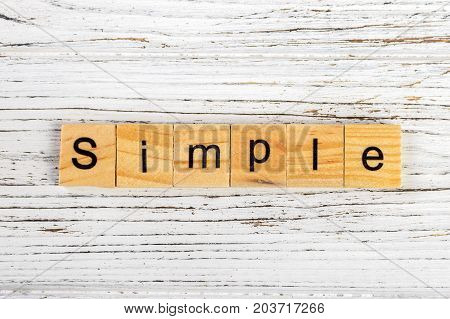 SIMPLE word made with wooden blocks concept
