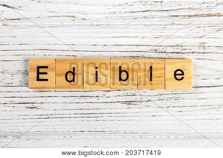 EDIBLE word made with wooden blocks concept