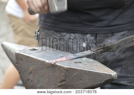 Blacksmith Wotk With Hammer And Hot Iron