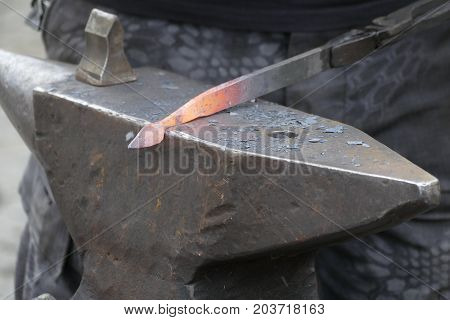 Blacksmith Wotk With Hammer And Hot Iron
