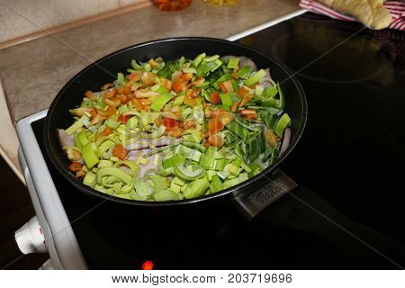 Chicken With Fresh Vegetables On A Frying Pan