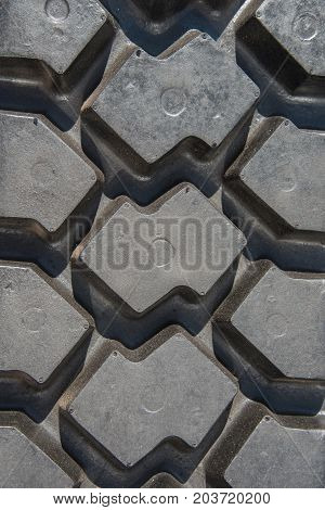 Tread pattern of automotive black rubber tire close-up