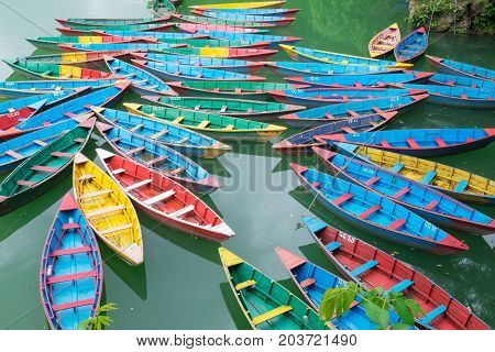 Traditional Nepalese Boats At The Docks At Fewa Lake, Pokhara City, Nepal