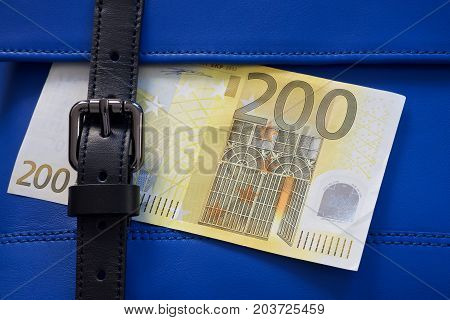 blue leather bag stitching with black buckle and euro