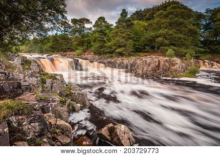 Low Force and Whin Sill, as the River Tees cascades over the Whin Sill at Low Force Waterfall and the Pennine Way follows the southern riverbank