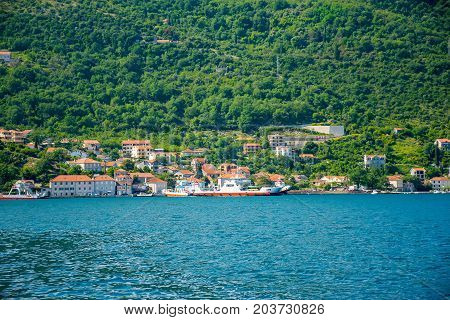 Montenegro, Kamenari And Lepetane - June 04/2017: Sea Ferries Carry Cars And Buses With Tourists Bet