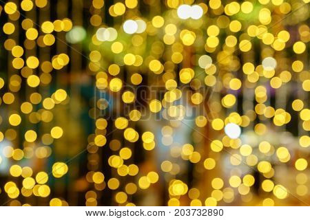 Defocused lights abstract golden nonagon bokeh background
