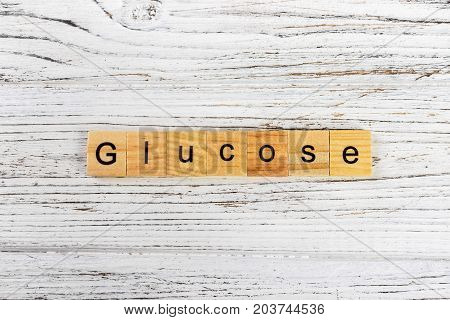 GLUCOSE word made with wooden blocks concept