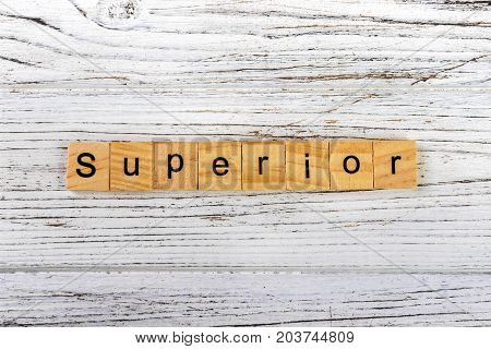 SUPERIOR word made with wooden blocks concept