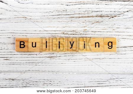 BULLYING word made with wooden blocks concept