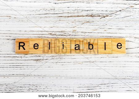RELIABLE word made with wooden blocks concept