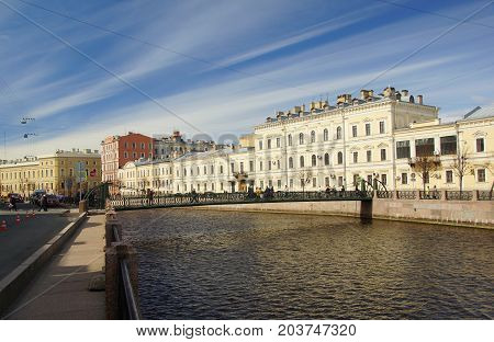 A walk along the embankment of the Moika River in St. Petersburg the Pochtamtsky Bridge