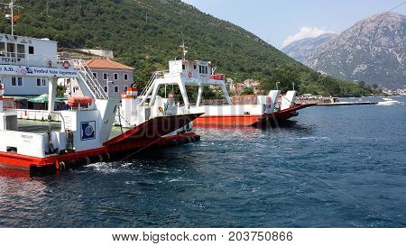 Kamenari, Montenegro - June 26, 2017: Ferries which transport cars the short distance from Lepetane to Kamenari on the Montenegrin coast.