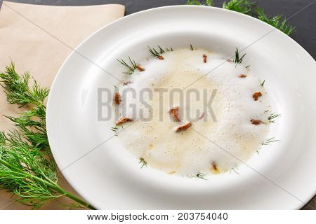Delicious cream soup with honey fungus close up. Gourmet meal with mushrooms, restaurant serving
