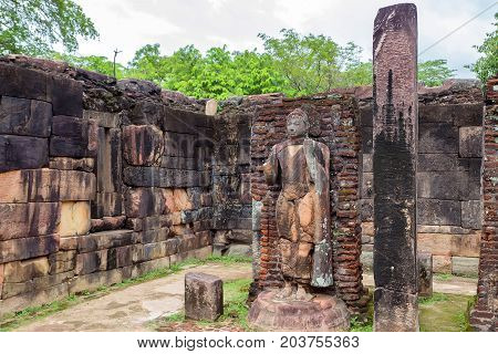 Statue of standing Buddha in Hatadage in Polonnaruwa ruins. Unesco world heritage on Sri Lanka.