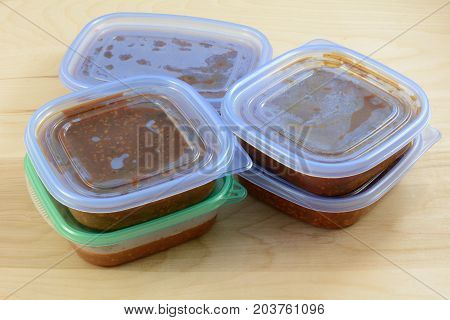 Batch of cooked turkey spaghetti sauce pit in storage containers for freezing for quick future meals