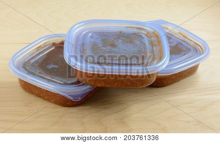 Batch of cooked turkey spaghetti sauce pit in storage containers for freezing for quick future meals
