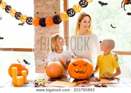 Ecxited Mommy With Two Small Blond Adorable Kids Is Prepared Jackolantern At Decorated Nice Loft Roo
