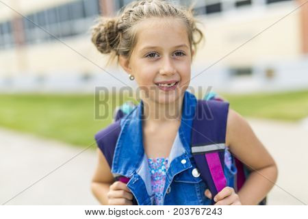 The Great Portrait Of School Pupil Outside Classroom Carrying Bags