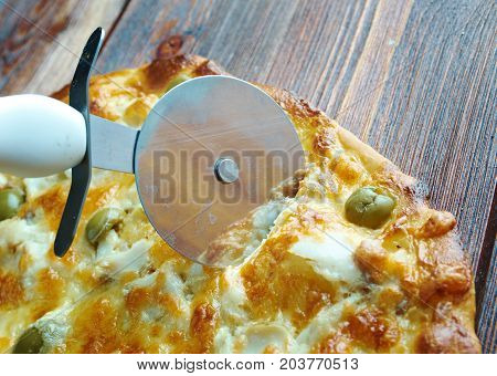 homemade pizza with rockfish . Close up